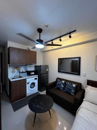 Kuchyň nebo kuchyňský kout v ubytování Cozy Studio Apartment
