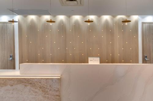 a room with a wooden wall with lights on it at Crowne Plaza Hotel & Resorts Fort Lauderdale Airport/ Cruise by IHG in Fort Lauderdale