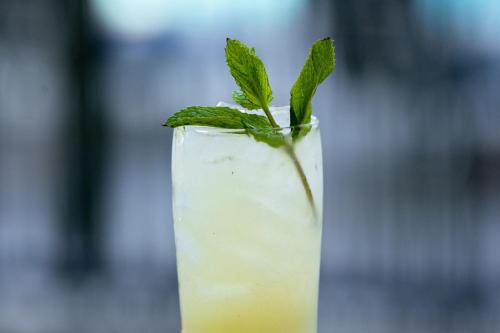 a green drink with a mint leaf on top at Sheraton Universal in Los Angeles