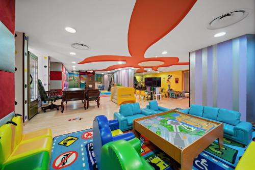 a childrens play room with a table and chairs at InterContinental Dar Al Tawhid Makkah by IHG in Makkah