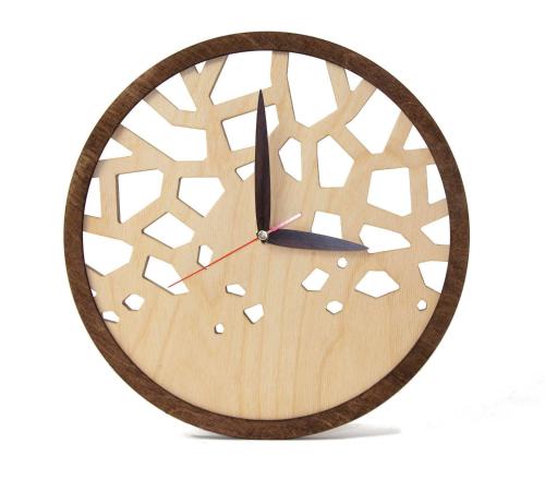 a wooden clock with a geometric design on it at STUDIO FLAT in Belvedere