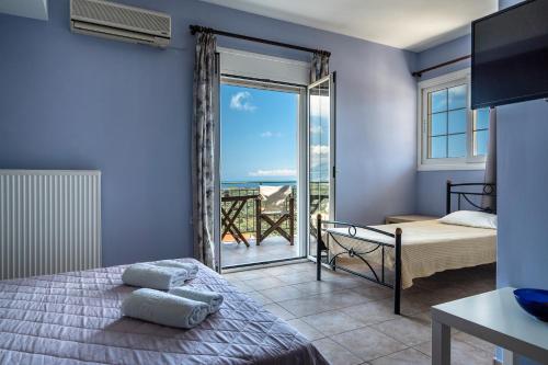 A bed or beds in a room at Ionian Balcony 2