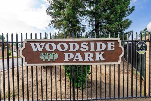 a sign for a woodridge park on a fence at Townhouse Suite by FSU SaveMartCenter in Fresno