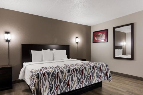 a bed in a hotel room with a large bed at Red Roof Inn Hartford- New Britain in New Britain