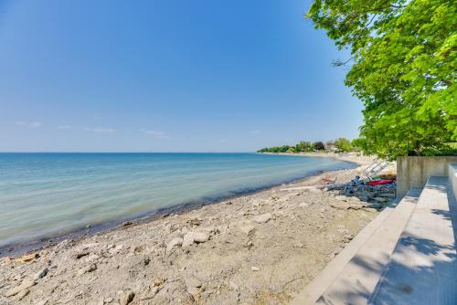 a view of a sandy beach with trees and the ocean at Turtle Cove Bay Beach House about 13 Mi to Buffalo! in Lake View