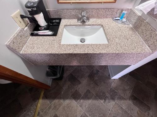 a bathroom counter with a sink in a room at BIGGS NU-VU MOTEL in Biggs Junction