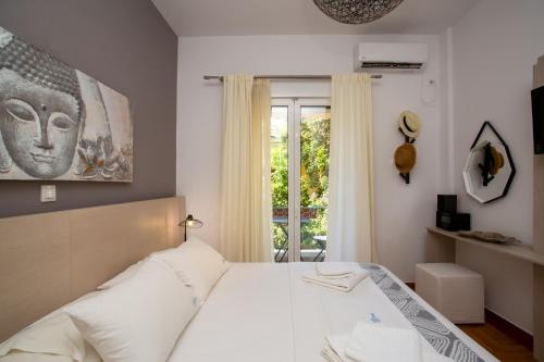 Postel nebo postele na pokoji v ubytování Hadrian by Heloni Apartments
