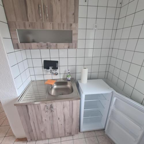 a small kitchen with a sink and a counter at Vila Slavonija 2 in Vrnjačka Banja