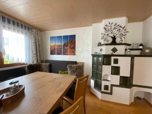 a dining room with a wooden table and chairs at Sun Chalet in Schladming