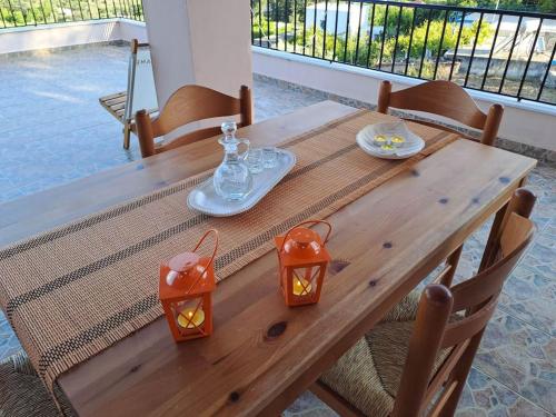 a wooden table with two lights on top of it at Fully equipped apartment in Apokoronas in Nípos