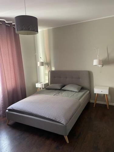 Postel nebo postele na pokoji v ubytování Cozy Sauna Apartment