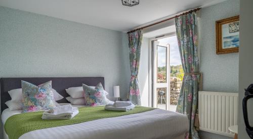 Кровать или кровати в номере Grassholme Cottage