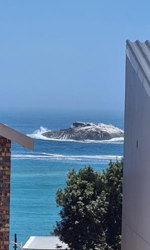 a view of an island in the ocean from a building at Bella Vista Yzerfontein - No loadshedding - Home away from home in Yzerfontein