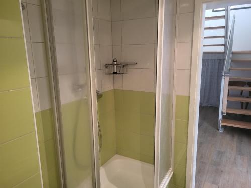 a shower with a glass door in a bathroom at Der Landhof Wildrose in Stolpe