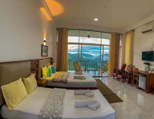 a hotel room with two beds and a balcony at Cozy Resort Ella in Ella