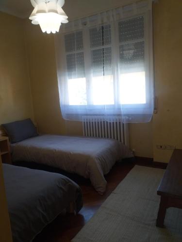 Ένα ή περισσότερα κρεβάτια σε δωμάτιο στο Casa Patrone appartamento Luigi