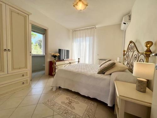 Postel nebo postele na pokoji v ubytování Villa Donati 6 camere in centro Forte dei Marmi