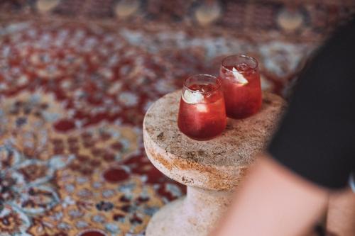 two candles sitting on top of a stone pillar at Hotel Kitchen59 in Sofia