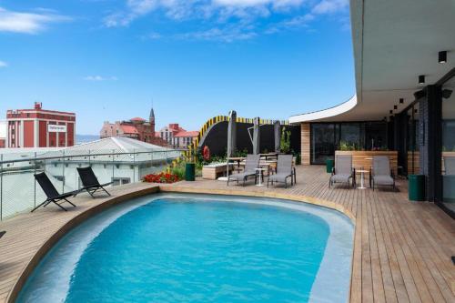 a swimming pool on the roof of a building at Wex1 Style living in Cape Town