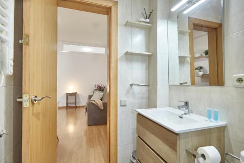 a bathroom with a sink and a mirror at BBarcelona Sagrada Familia Terrace Flat in Barcelona