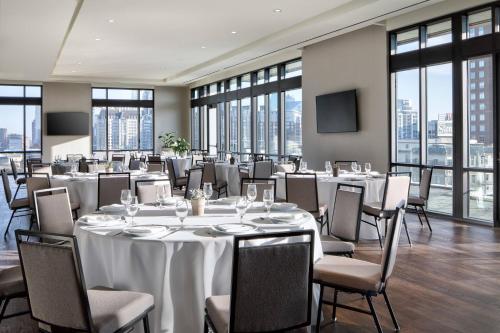 a conference room with tables and chairs and windows at Marriott Dallas Uptown in Dallas