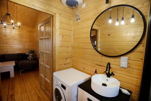 a bathroom with a sink and a mirror at Domek Całoroczny Powidz tel 512-589-997 in Powidz