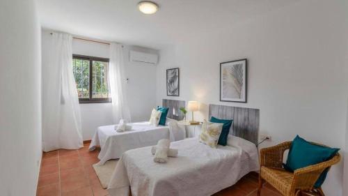 Postel nebo postele na pokoji v ubytování VILLA CARMEN MENYBER