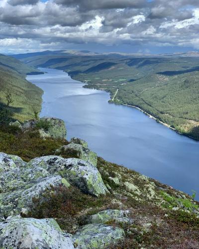 a view of a body of water from a mountain at In the middle of Trysil fjellet - Welcome Center - Apartment with 4 bedrooms and sauna - By bike arena and ski lift in Trysil