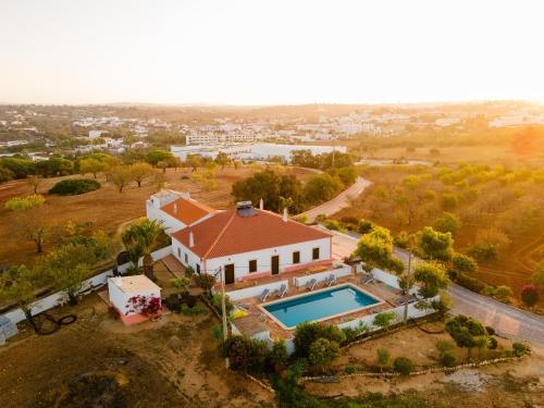 an aerial view of a house with a swimming pool at Quinta Coelho in Guia