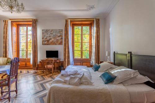 Postel nebo postele na pokoji v ubytování Manoir de la Manantie - Teritoria