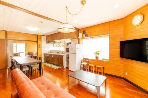 a living room with a couch and a table at えびす家 in Ishigaki Island