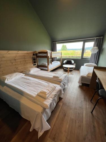 Postel nebo postele na pokoji v ubytování Fjellkysten