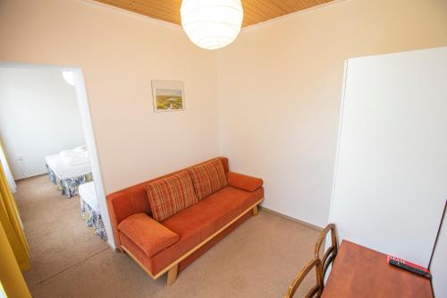 a living room with a couch in a room at Pension v parku Český Šternberk in Český Šternberk