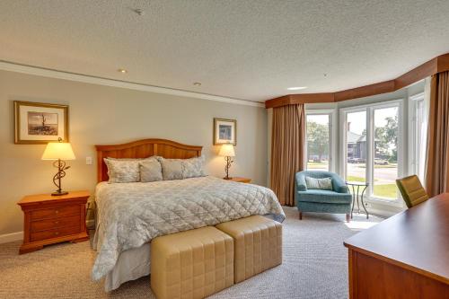 a bedroom with a bed and a chair and windows at Williamsburg Condo Rental 3 Mi to Busch Gardens! in Williamsburg