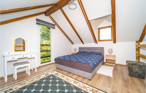 a bedroom with a bed and a desk at Lovely Home In Duga Resa With Outdoor Swimming Pool in Duga Resa