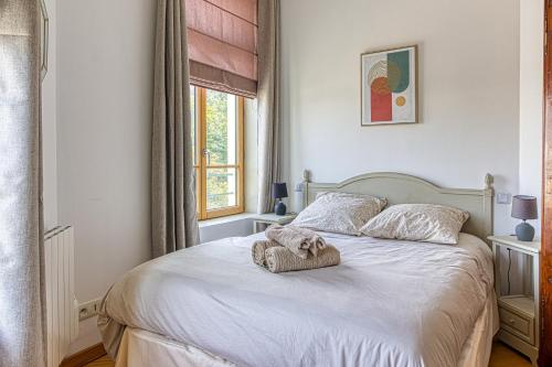 Un pat sau paturi într-o cameră la Le Blériot - Idéalement situé avec sauna