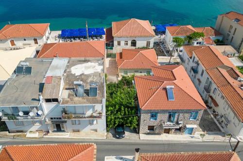 an aerial view of buildings with orange roofs at Katina's Coastal Oasis in Pylos