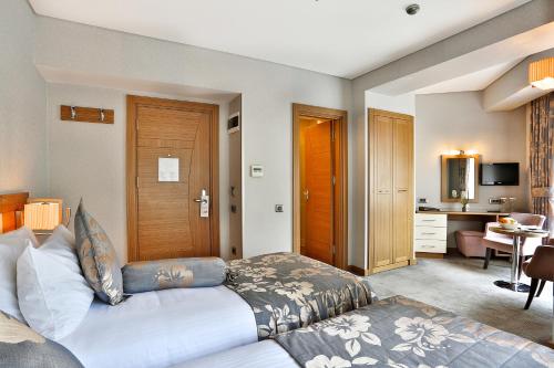 Телевизор и/или развлекательный центр в Hotel Momento - Special Category