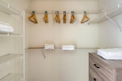 een inloopkast met planken en hangers bij San Jose 2br w sauna pool games nr groceries SFO-1416 in San Jose