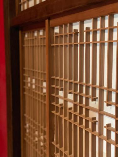 a wooden door with bars on a window at Villa Sacra in Kamakura