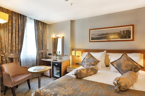 Säng eller sängar i ett rum på Hotel Momento - Special Category