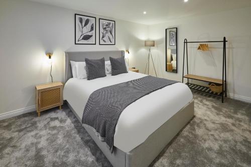 a bedroom with a large white bed and two lamps at Host & Stay - 2 The Mount in Whitby