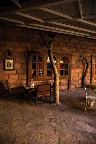 a room with a tree in the middle of a building at Park Plaza Jodhpur in Jodhpur