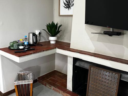 Η κουζίνα ή μικρή κουζίνα στο 1020 Sehudi Guesthouse