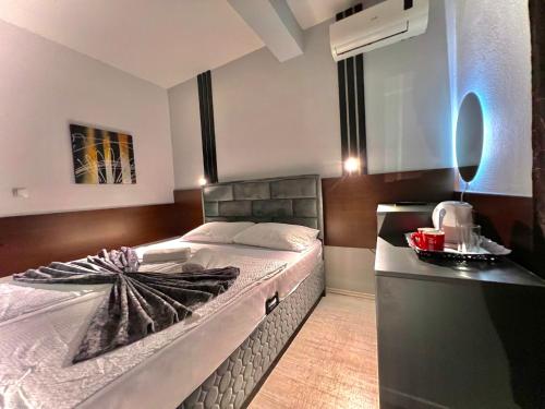 Ένα ή περισσότερα κρεβάτια σε δωμάτιο στο Hotel & Spa Villa Luxe