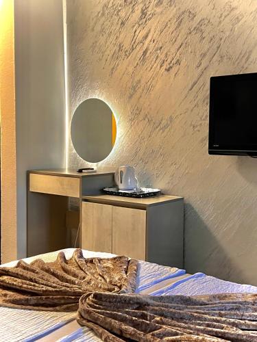 Μια τηλεόραση ή/και κέντρο ψυχαγωγίας στο Hotel & Spa Villa Luxe
