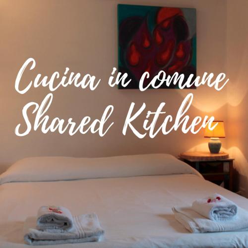 a bedroom with a bed with towels on it at Guesthouse Runcini in Ferentillo