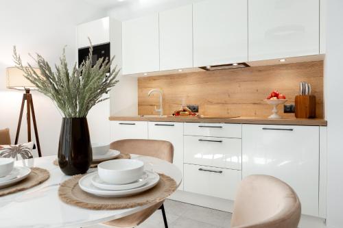 Η κουζίνα ή μικρή κουζίνα στο Apartamenty In Belnihel