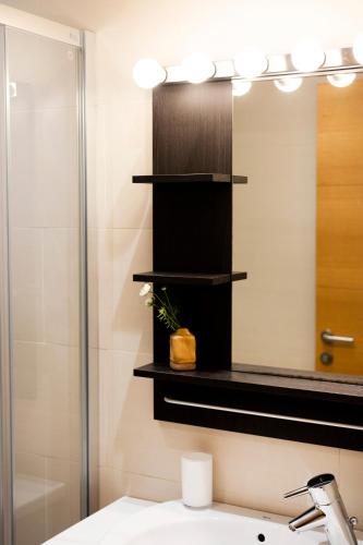 a bathroom with a sink and a mirror at Jaizkibel by Basquelidays in Hondarribia