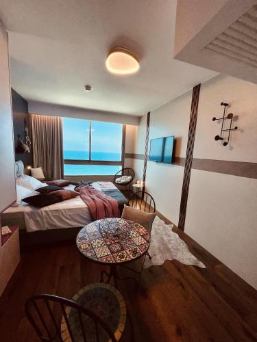 Postel nebo postele na pokoji v ubytování Carmel Holiday Apartments
